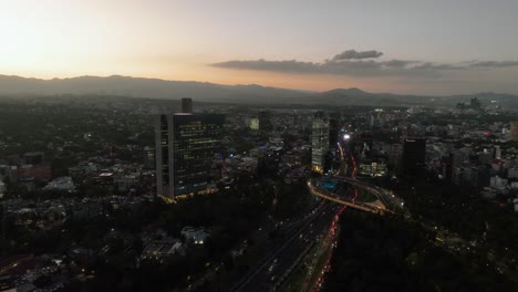 Aerial-view-around-the-Virreyes-building-and-the-Petroleos-Fountain,-sunny-evening-in-Mexico-city---circling,-drone-shot