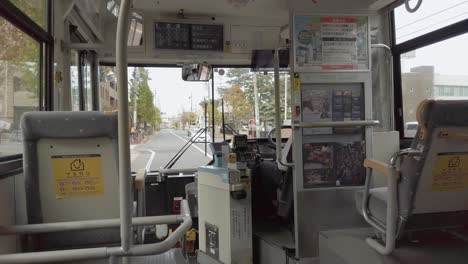 inside-the-bus-while-running-in-fukuoka-hakata-city-in-Japan-in-daytime,-japan-public-transportation