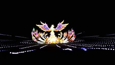 Illuminated-Phoenix-sculpture-at-Lightopia-in-Crystal-Palace-park,-London