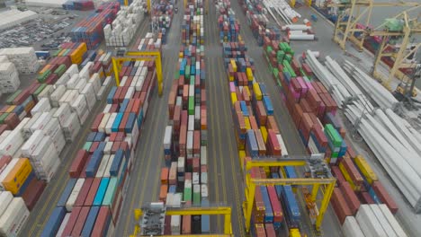 An-aerial-view-of-the-container-terminal-in-the-port-shows-rows-of-containers-with-goods-waiting-to-be-loaded-onto-ships