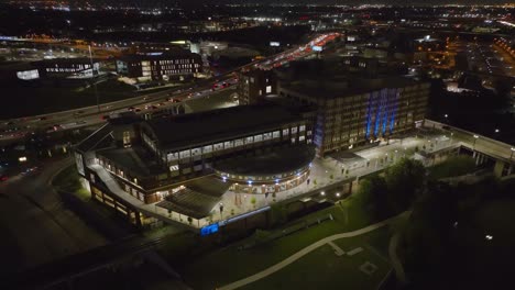 Aerial-view-around-the-University-of-Houston-Downtown,-night-in-Texas,-USA---orbit,-drone-shot