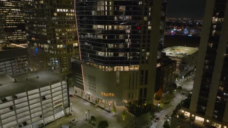 Aerial-view-towards-the-Brava-apartment-high-rise-in-downtown-Houston,-night-in-Texas,-USA