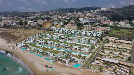 Scenic-aerial-view-of-swimming-pools-and-luxury-resorts-dotting-the-hills-of-Batroun,-Lebanon