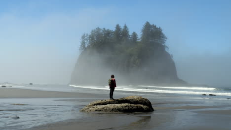 Woman-Standing-on-Rock-Gazing-at-Ocean-Waves,-Sea-Stack,-and-Fog-at-Second-Beach
