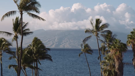 Scenic-view-from-Wailea-beach-with-Palm-Trees-towards-West-Maui-Mountains-and-wind-Farm,-Hawaii,-Panorama