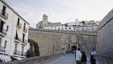 Gimbal-move-to-the-left-with-the-entrance-of-the-Castle-of-Ibiza-Spain-during-sunset