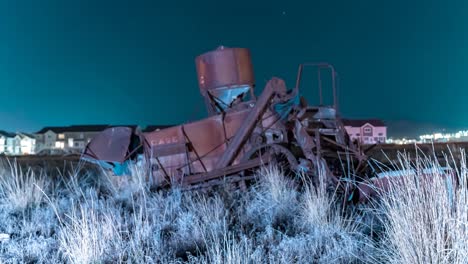 Vintage-Chase-farm-equipment-abandoned-in-a-field---nighttime-motion-time-lapse