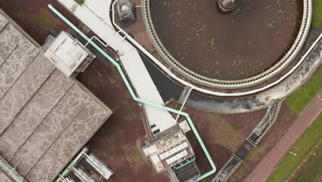 Aerial-shot-of-a-sewage-plant-following-the-rushing-water-through-the-process