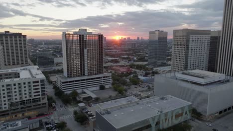 Aerial-view-over-Tellepsen-Family-Downtown-YMCA,-towards-sunrise-above-Midtown,-Houston,-USA