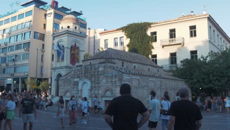 People-pass-by-the-Church-of-the-Pantanassa-in-Monastiraki-square