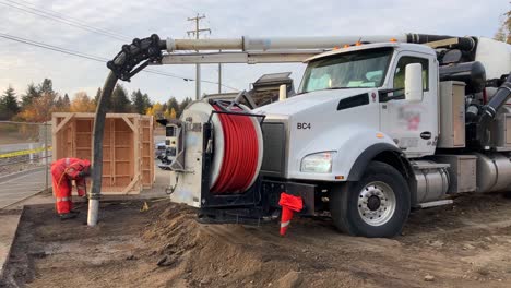 Experience-the-power-of-a-hydrovac-truck-and-construction-worker-as-they-safely-expose-underground-utility-lines