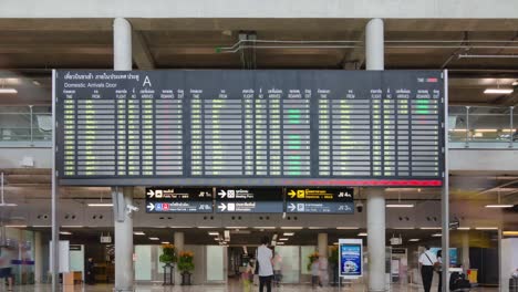 timelapse-view-inside-arrival-terminal-with-many-passenger-while-checking-information-arrival-board