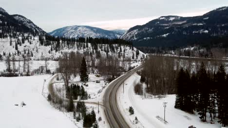 Winter-Journey-on-Yellowhead-Highway-5:-Cars-Cruising-South-through-Snow-Covered-Mountains-and-Beautiful-Forest-in-Little-Fort,-BC