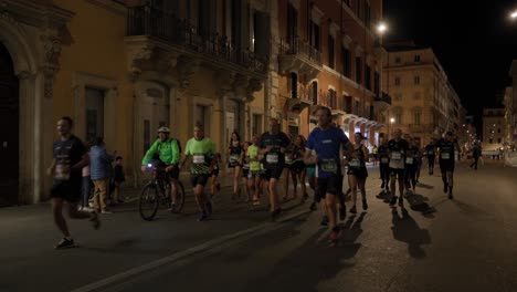 Runners-Taking-Part-In-The-Marathon-Running-In-The-Early-Morning-In-Rome,-Italy