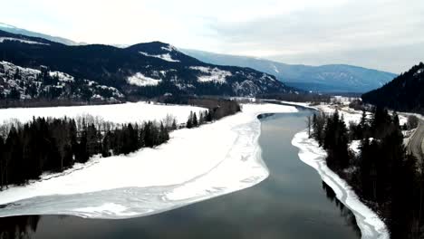 Snow-Covered-North-Thompson-River-and-Lush-Forests-in-Winter-Near-Kamloops,-BC:-A-Picturesque-Scene