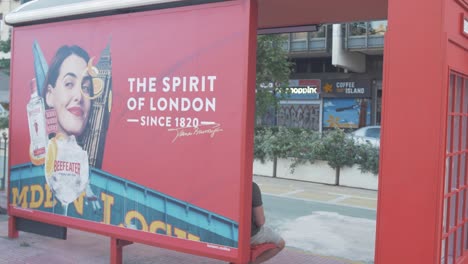 Alcoholic-beverage-advertisement-for-gin-on-Athens-bus-stop