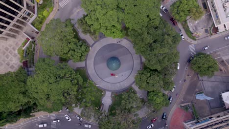 Drone-flying-over-La-Castellana-roundabout,-during-Christmas-in-Caracas,-Venezuela