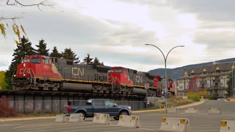 Trains-driving-in-Downtown-British-Columbia-in-the-Fall-driving-towards-the-South-Thompson-River-Kamloops-CNR-Bridge
