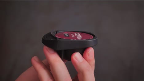 Costa-Coffee-Capsule-falls-directly-into-a-coffee-pod-holder-in-a-man's-hand