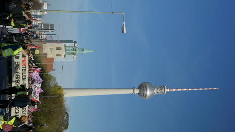 VERTICAL-Berliner-Fernsehturm-city-tower-protesters-voice-opinion-on-Berlin-economic-inflation-crisis-issue