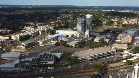 Aerial-shot-of-Australian-roads-in-busy-suburb-with-Railway-heavy-traffic-and-cars-and-businesses---Blacktown-NSW