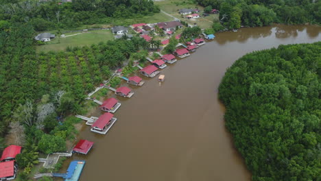 Drone-view-of-villas-on-riverside-in-Rompin-Pahang,-Malaysia