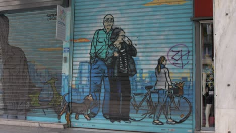Innercity-graffiti-spray-painted-mural-on-shopfront-shuttering
