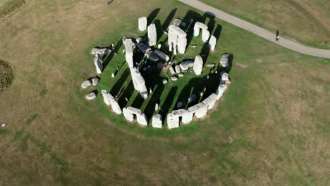 Prehistoric-Stonehenge-stone-circle-on-Amesbury-countryside-aerial-view-flying-overhead