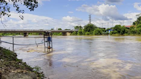 Severe-Flash-Flooding-With-Flowing-River-Under-A-Road-Bridge-In-Chiang-Mai-Province,-Northern-Thailand
