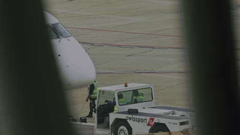Towing-tractor-pushes-an-Azul-Airlines-jet-away-from-the-departure-gate