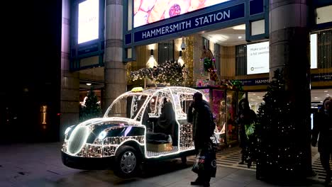 Christmas-Taxi-Outside-of-Hammersmith-Station,-London,-United-Kingdom