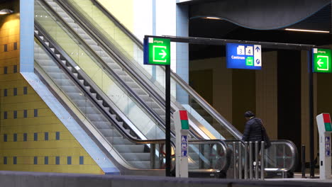 Traveler-Rides-On-Escalator-Moving-Up-At-The-NS-Station-Inside-The-Rotterdam-Blaak-In-Rotterdam,-Netherlands