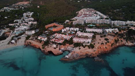 Aerial-View-Of-Cala-Tarida-Beach-Coastline-Resort-Hotels
