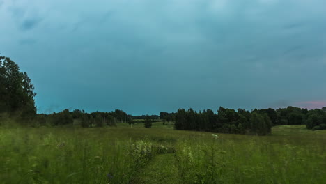 Timelapse-Of-Stormy-Grey-Overcast-Clouds-Rolling-Over-Meadow-Grassland