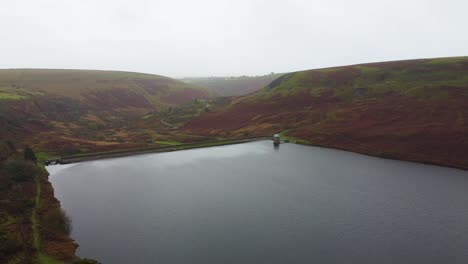 Reservoir-Aerial-View-with-Moorland-Background-and-Small-Building-in-Wales-UK---Drone-shot-4K