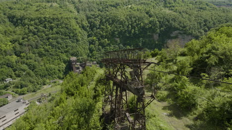 Rusty-freight-cableway-pylon-above-industrial-valley-in-Chiatura