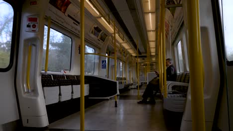 30-November-2022---Inside-View-Of-Metropolitan-Line-Train-Carriage-Travelling-Under-Road-Bridge-Near-Harrow