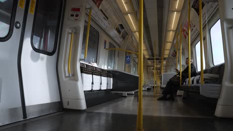 30-November-2022---Low-Angle-Inside-View-Of-Metropolitan-Line-Train-Carriage-Departing-Station