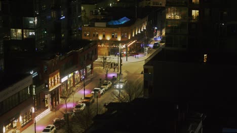 time-lapse-of-city-traffic-at-night-with-people-walking-on-sidewalks-and-across-streets