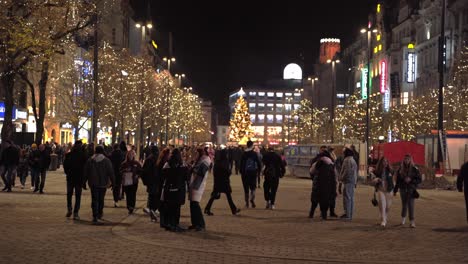 Tram-passing-on-Christmas-decorated-Wenceslas-square-at-night,-Prague