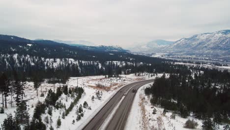 Highway-97-Journey:-Aerial-View-of-a-Fuel-Tanker-Semi-Truck-Traveling-Between-Kamloops-and-Vernon-with-Scenic-Mountains-in-the-Distance