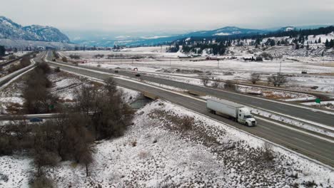 Aerial-View-of-Winter-Travel:-Cars-and-Semi-Trucks-Navigating-Highway-1-Between-Kamloops-and-Chase-on-an-Overcast-Day