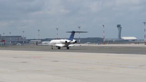 Bombardier-Global-Express-6000-Business-Jet-Moving-At-The-Taxiway-Of-Istanbul-Airport-In-Istanbul,-Turkey