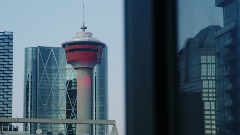 Close-up-of-Calgary-Tower-with-the-tall-city-buildings