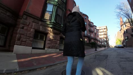 Woman-walking-in-the-Boston,-Massachusetts's-neighborhood-of-Beacon-Hill---low-angle-follow