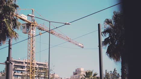 A-construction-crane-on-building-site-redevelopment-in-Piraeus-Region