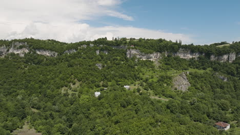 Steep-hillside-with-cliff-and-Katskhi-monastery-on-tall-rock-pillar