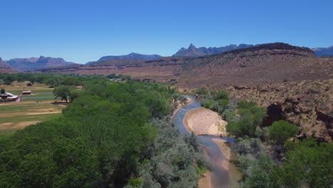 Drone-shot-of-Virgin-River-running-through-Mount-Zion-National-Park-located-in-Southern-Utah