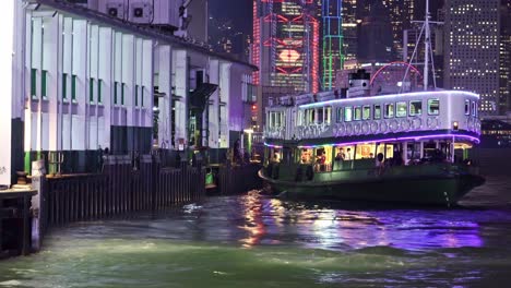 Star-Ferry-with-LED-light-on-board-parking-in-Tsim-Sha-Tsui-Pier,-Hong-Kong,-China
