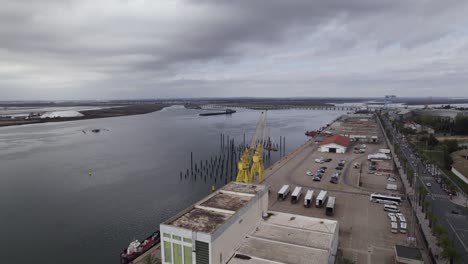 Aerial-arc-at-Port-of-Huelva-in-Spain-on-Odiel-river,-overcast-day